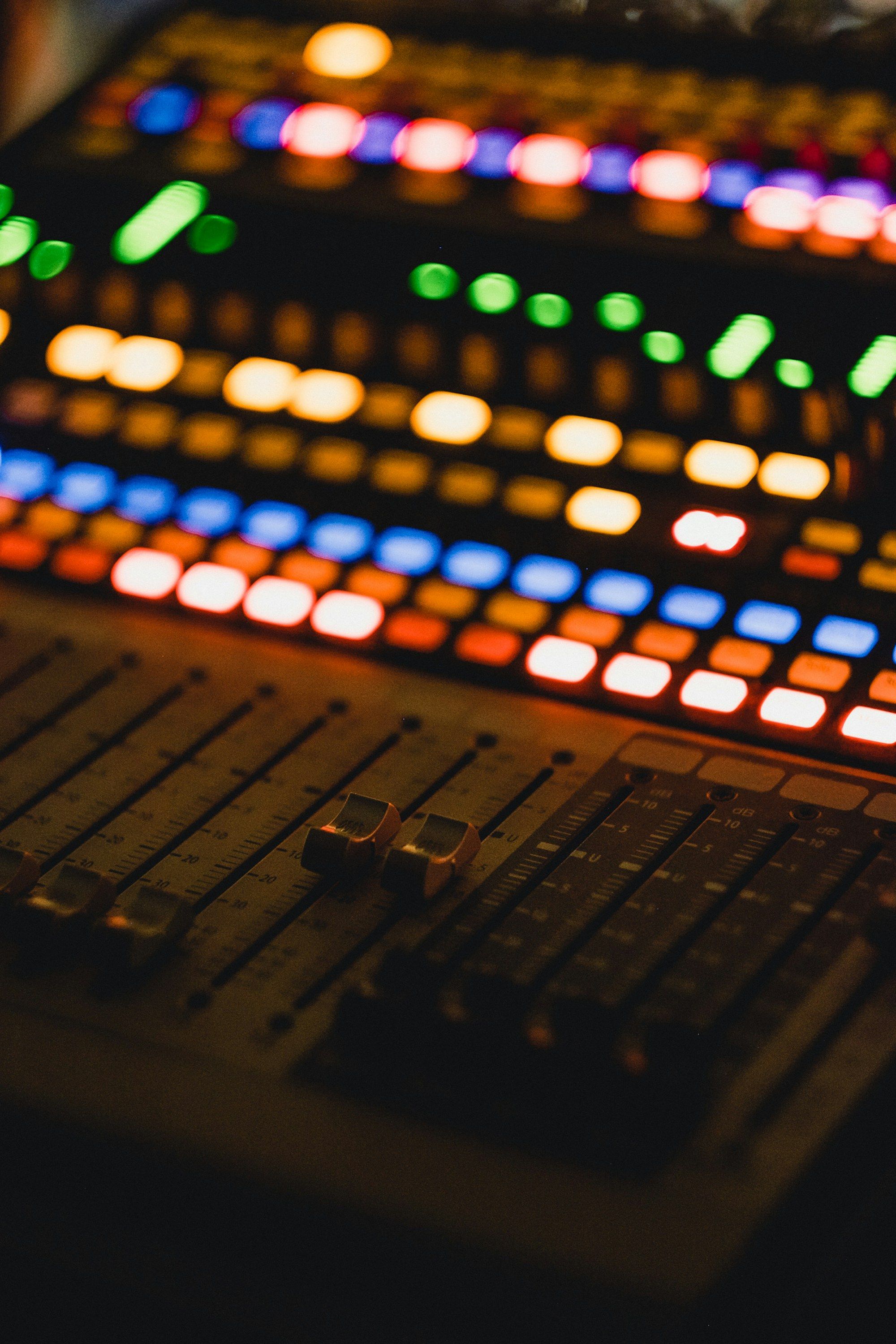 The faders of a sound mixing desk